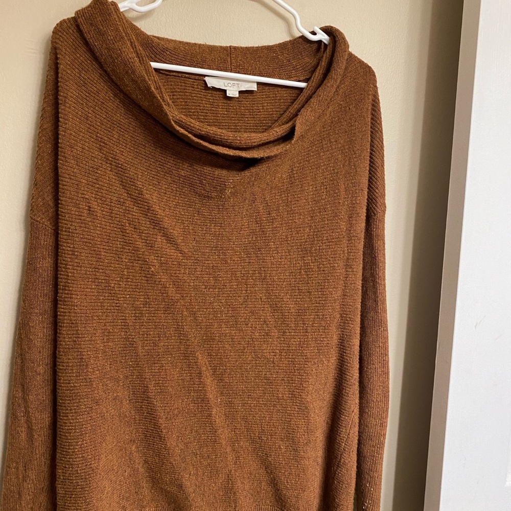 Left sweater, size medium.